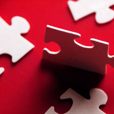 4 white jigsaw pieces with red background