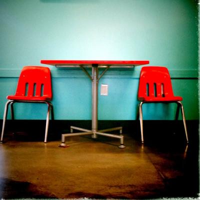 table with 2 empty chairs