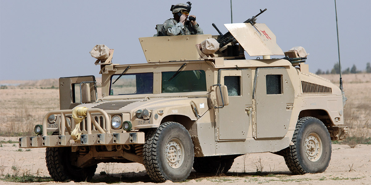 armored vehicle with soldier looking out